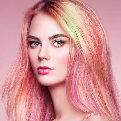 Beauty fashion model girl with colorful dyed hair. Girl with perfect makeup and hairstyle. Model with perfect healthy dyed hair